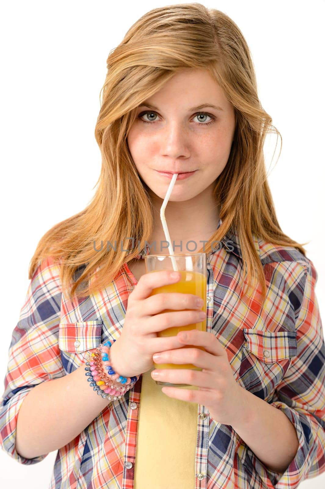 Pretty girl drinking juice with straw isolated on white background