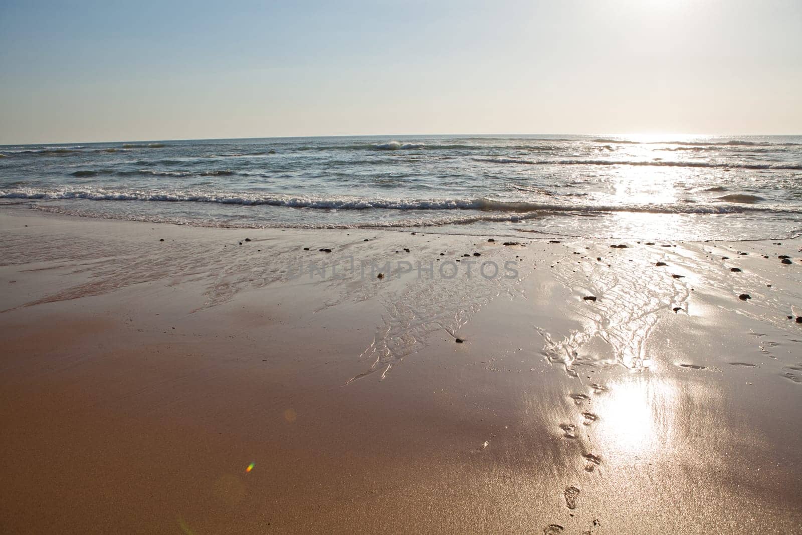Sunset on Atlantic coast of Portugal at Praia da Areia Branca