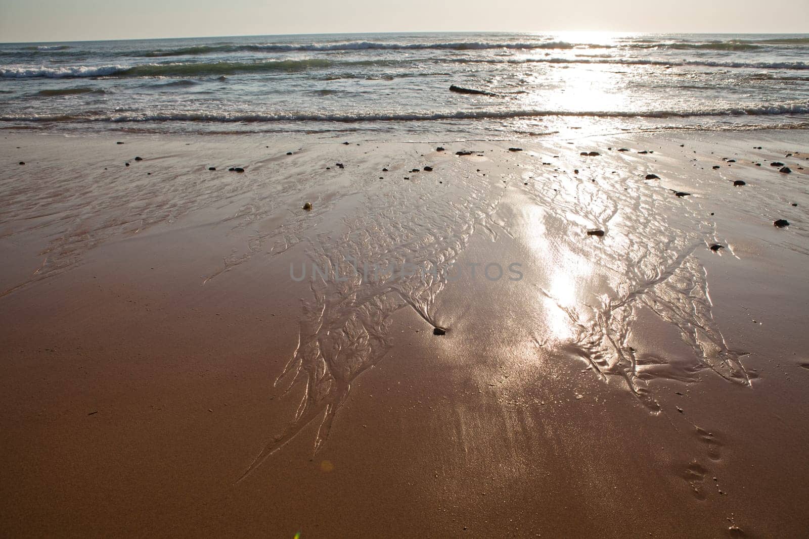 Sunset on Atlantic coast of Portugal at Praia da Areia Branca