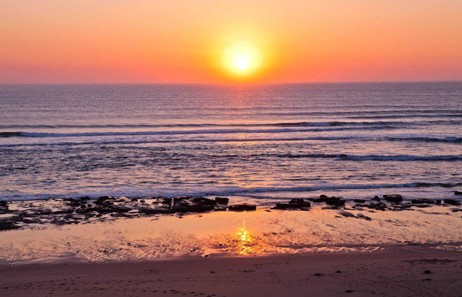 Sunset on Atlantic coast of Portugal at Praia da Areia Branca
