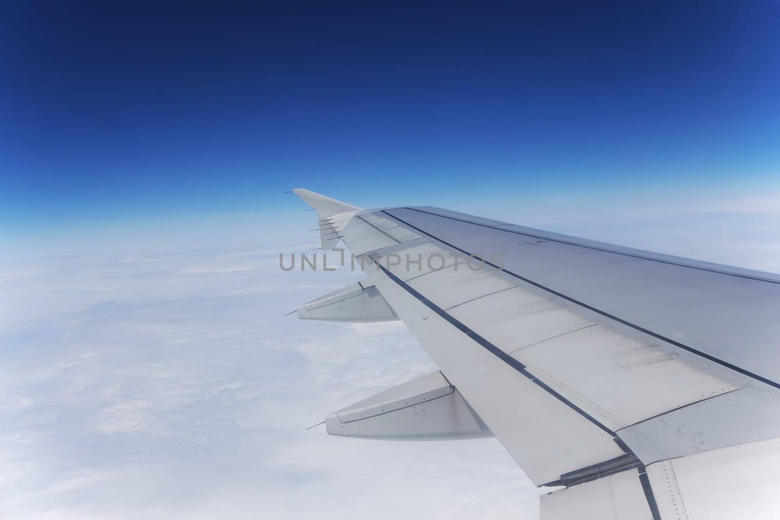 View out of airplane wing in flight. Horizontally.