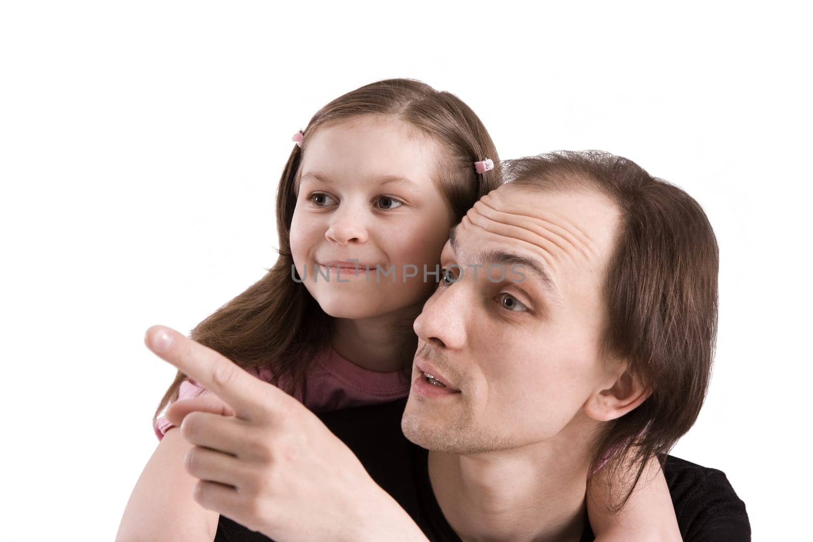 The father and the daughter attentively looking afar