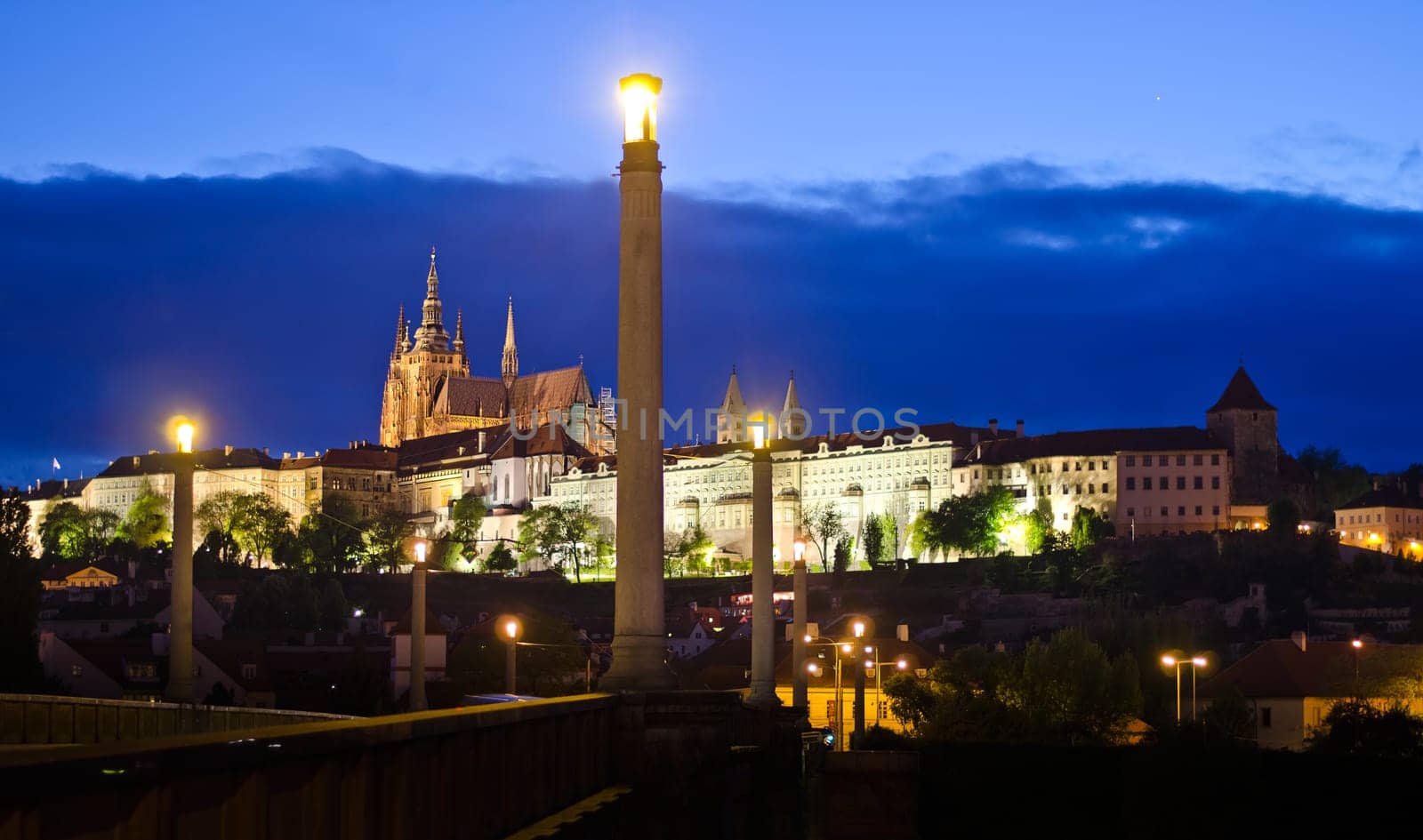Prague, Czech Republic. Night view of bridge, castle and cathedral