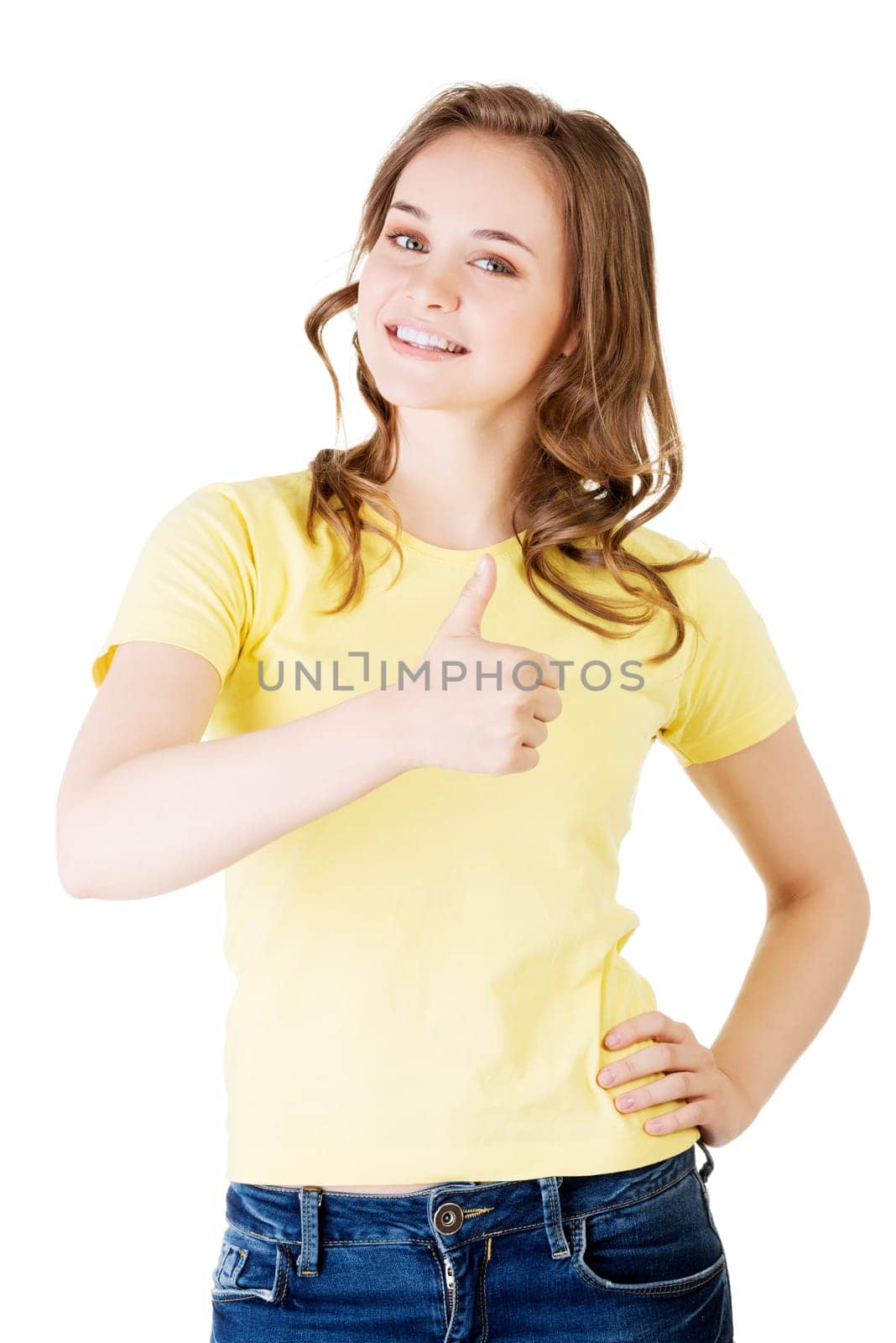 beautiful teen woman in casual clothes gesturing thumbs up. isolated
