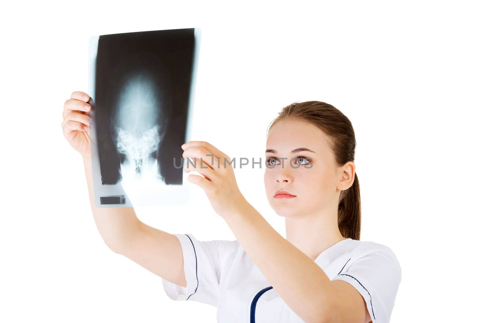 female doctor looking at an x-ray,isolated on white