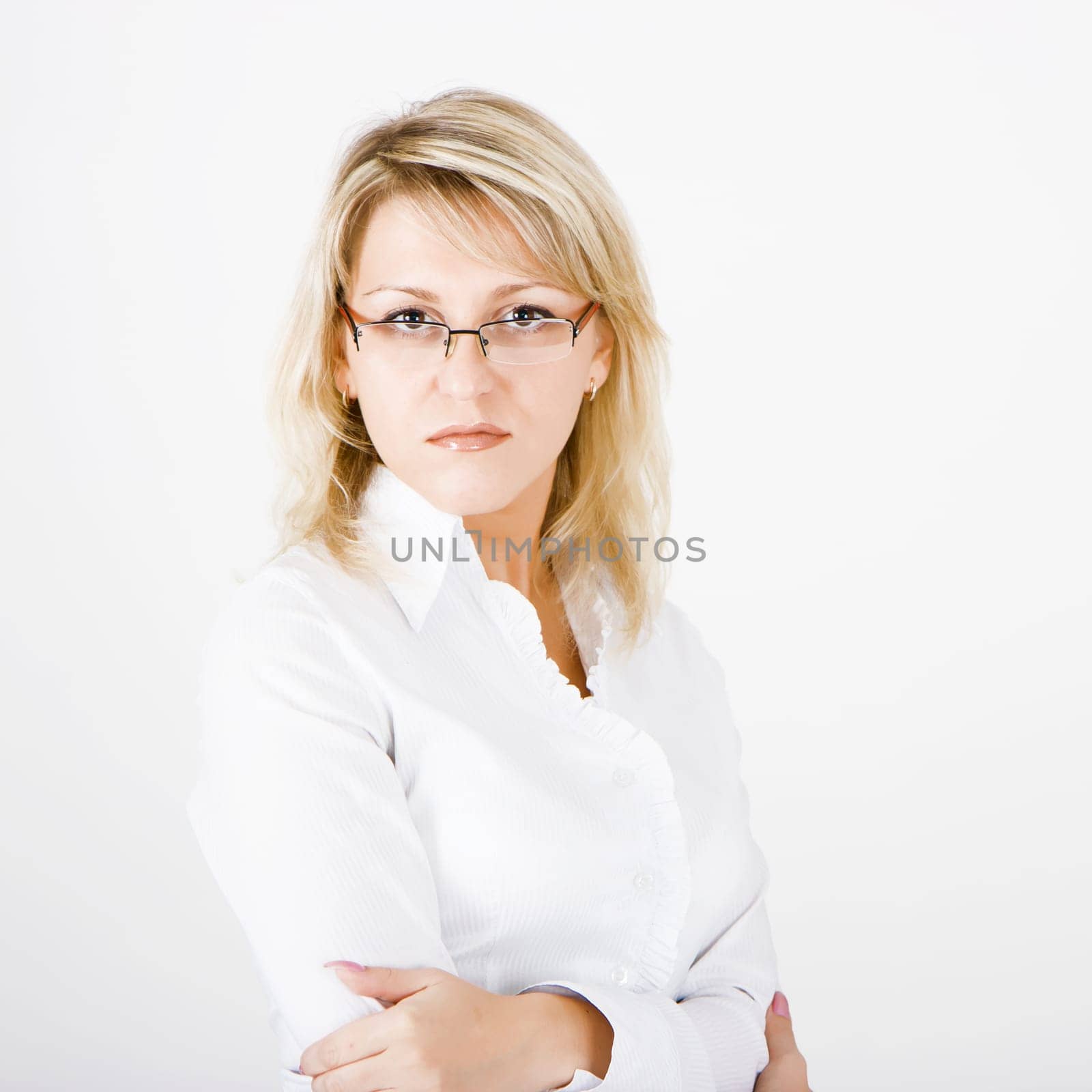 serious beautiful girl with glasses on a white background
