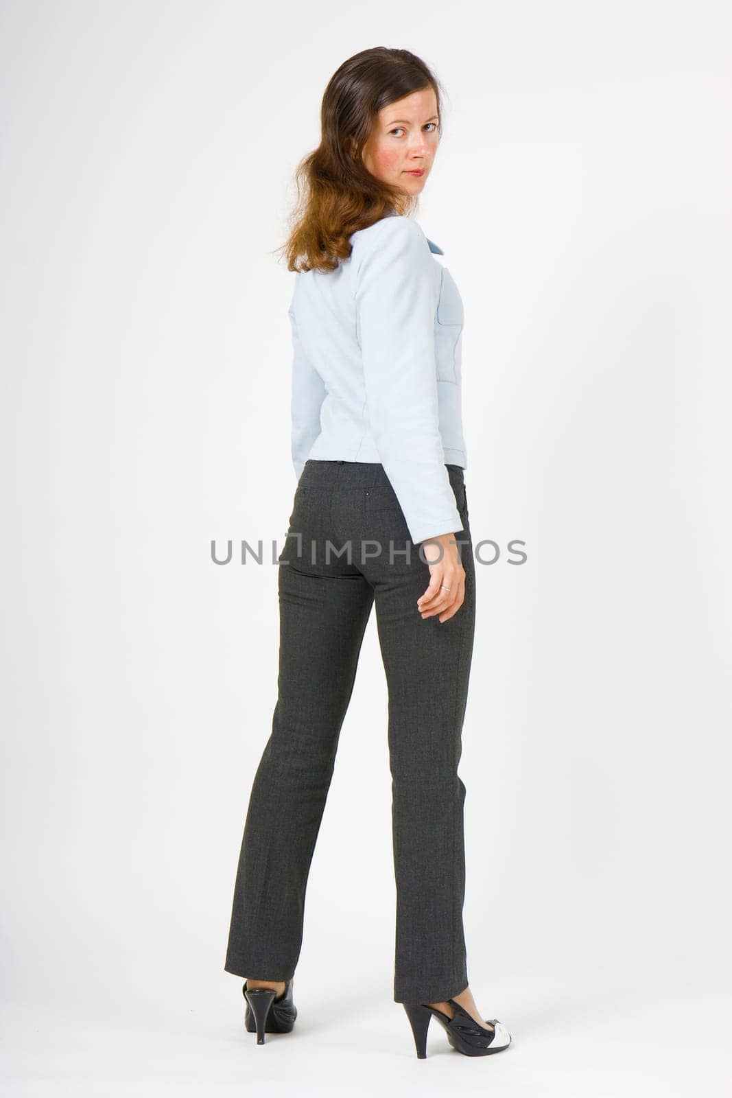 girl posing in a studio on a white background