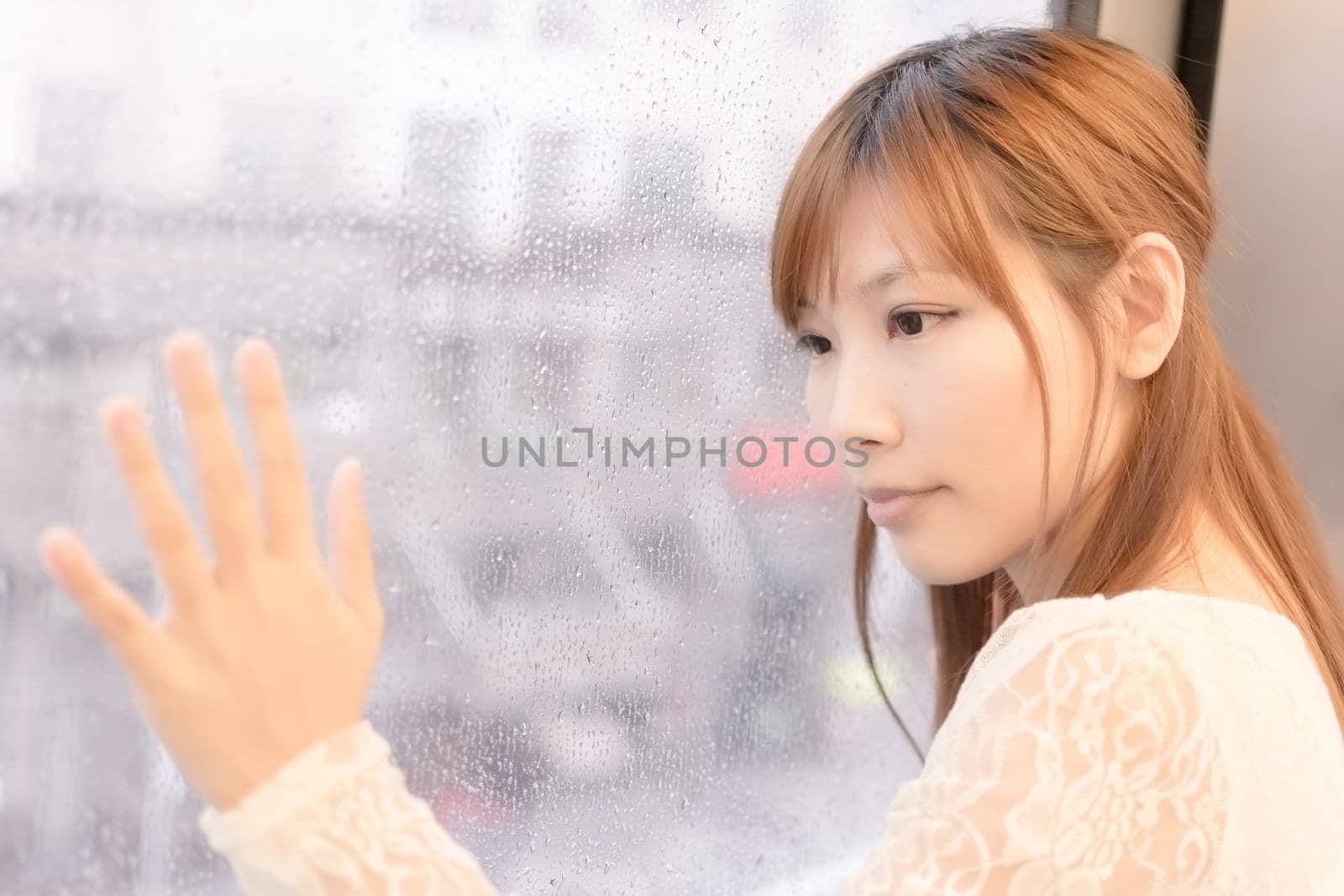 Asian beauty in MRT carriages look through the window into far away, Taipei, Taiwan.