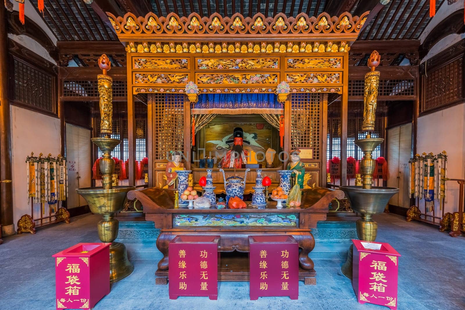 Shanghai, China - April 7, 2013: statues in the city god temple Chenghuang Miao  at the city of Shanghai in China on april 7th, 2013