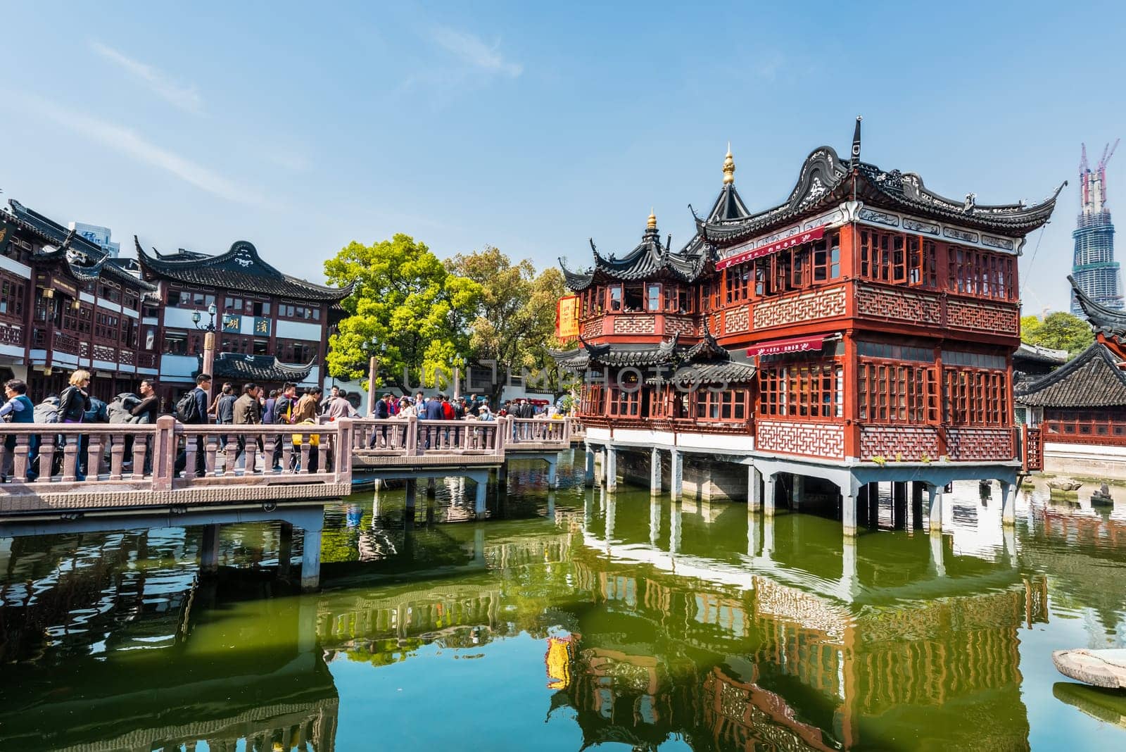 Shanghai, China - April 7, 2013: people outside of the oldest tea house of Fang Bang Zhong Lu  at the old city of Shanghai in China on april 7th, 2013