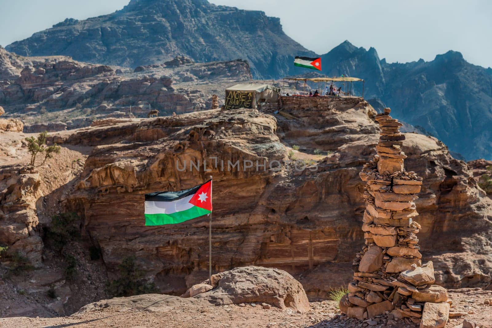 jordan flags floating  in nabatean petra  middle east