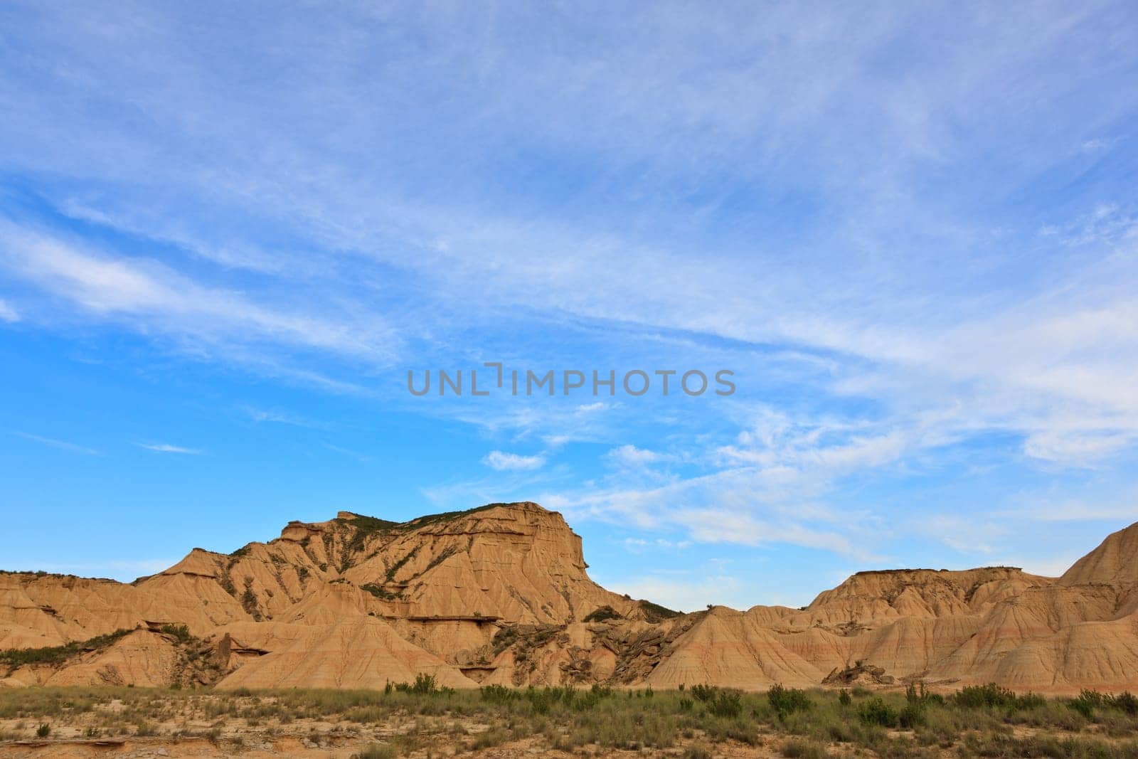 Desert landscape under the cloudy sky, Bardenas Reales, Navarra, Spain
