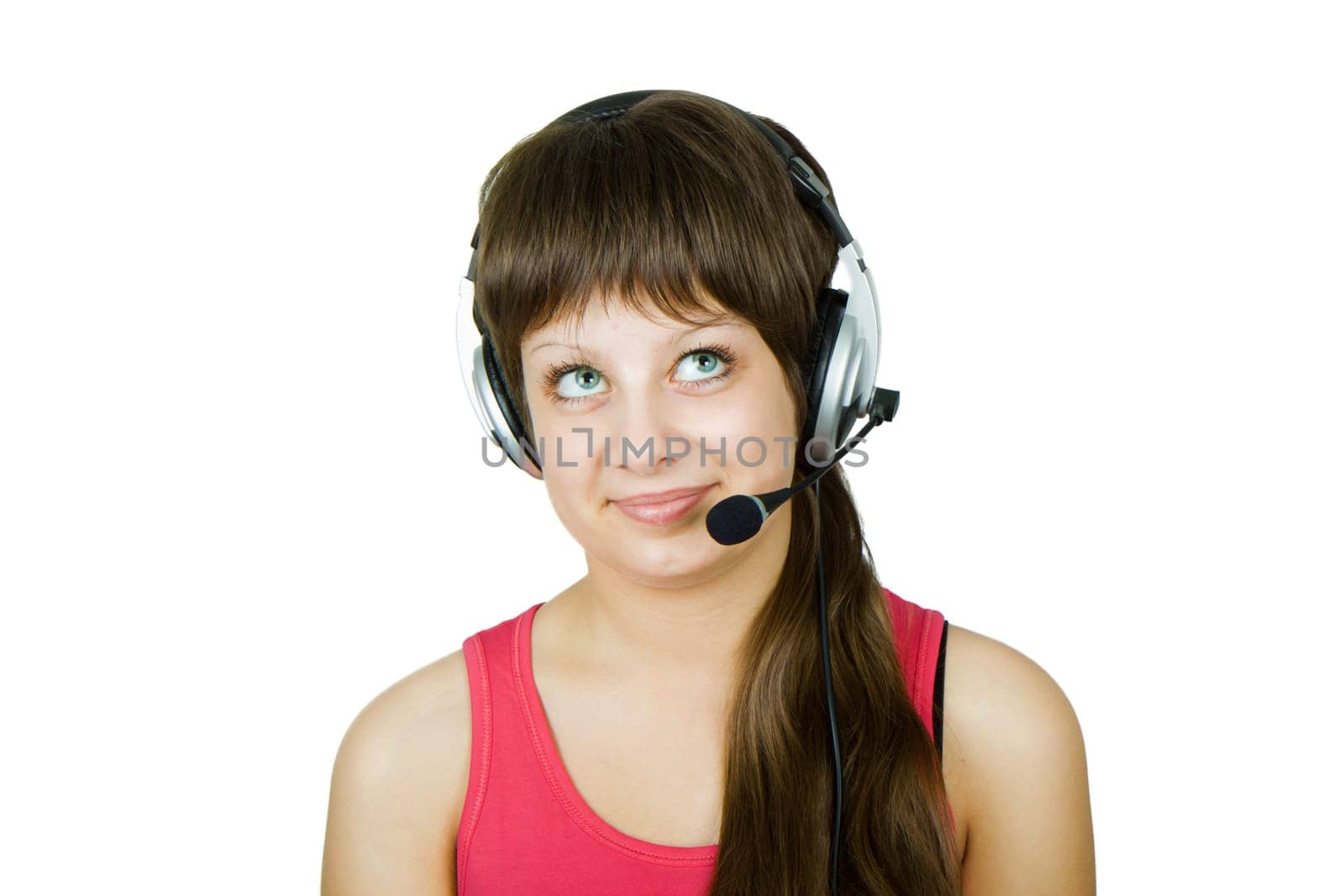 smiling girl in headphones with a microphone on the isolated white background