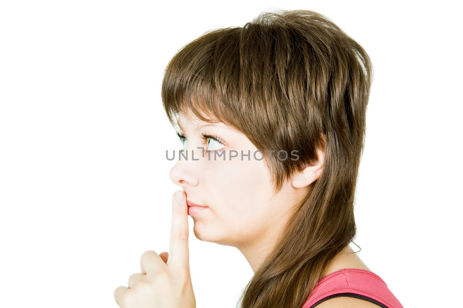 she presses the index finger to lips on an isolated white background