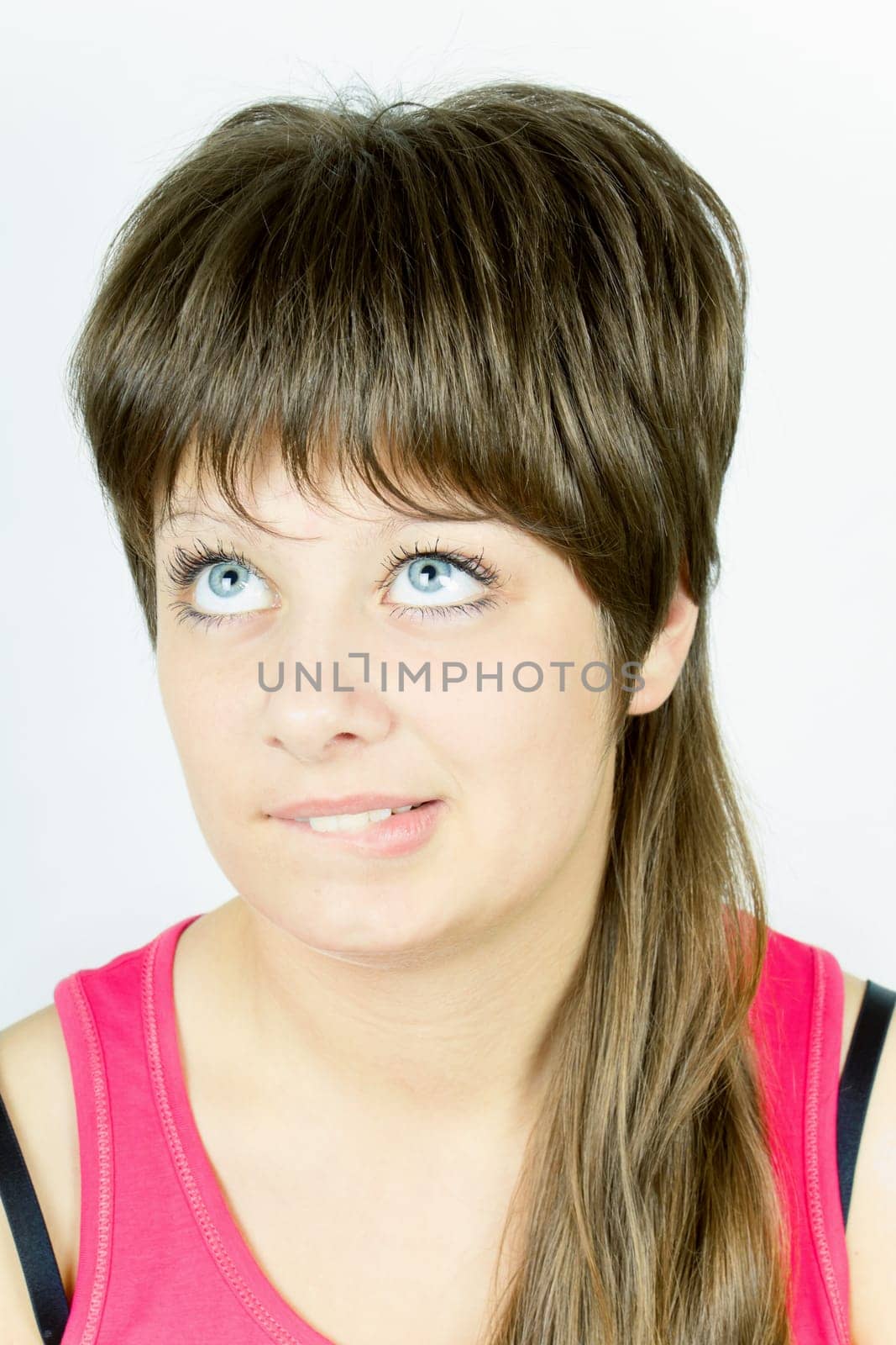 portrait of a beautiful blue-eyed girl on isolated white background