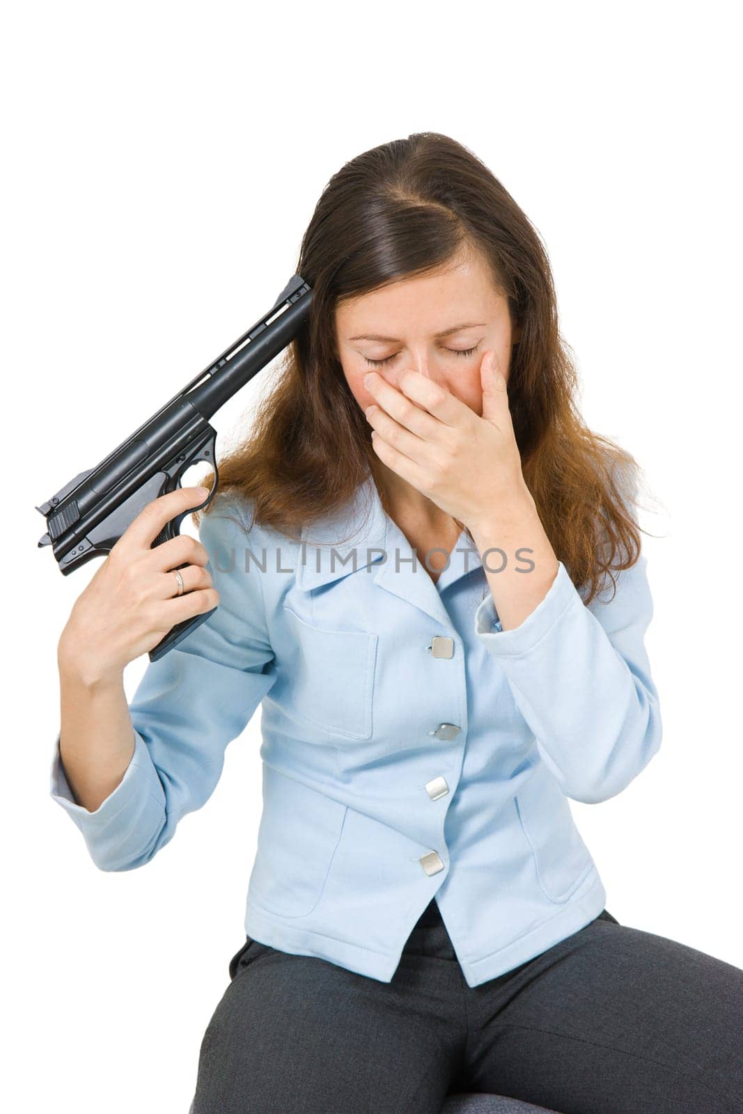 young woman aiming a gun at his head