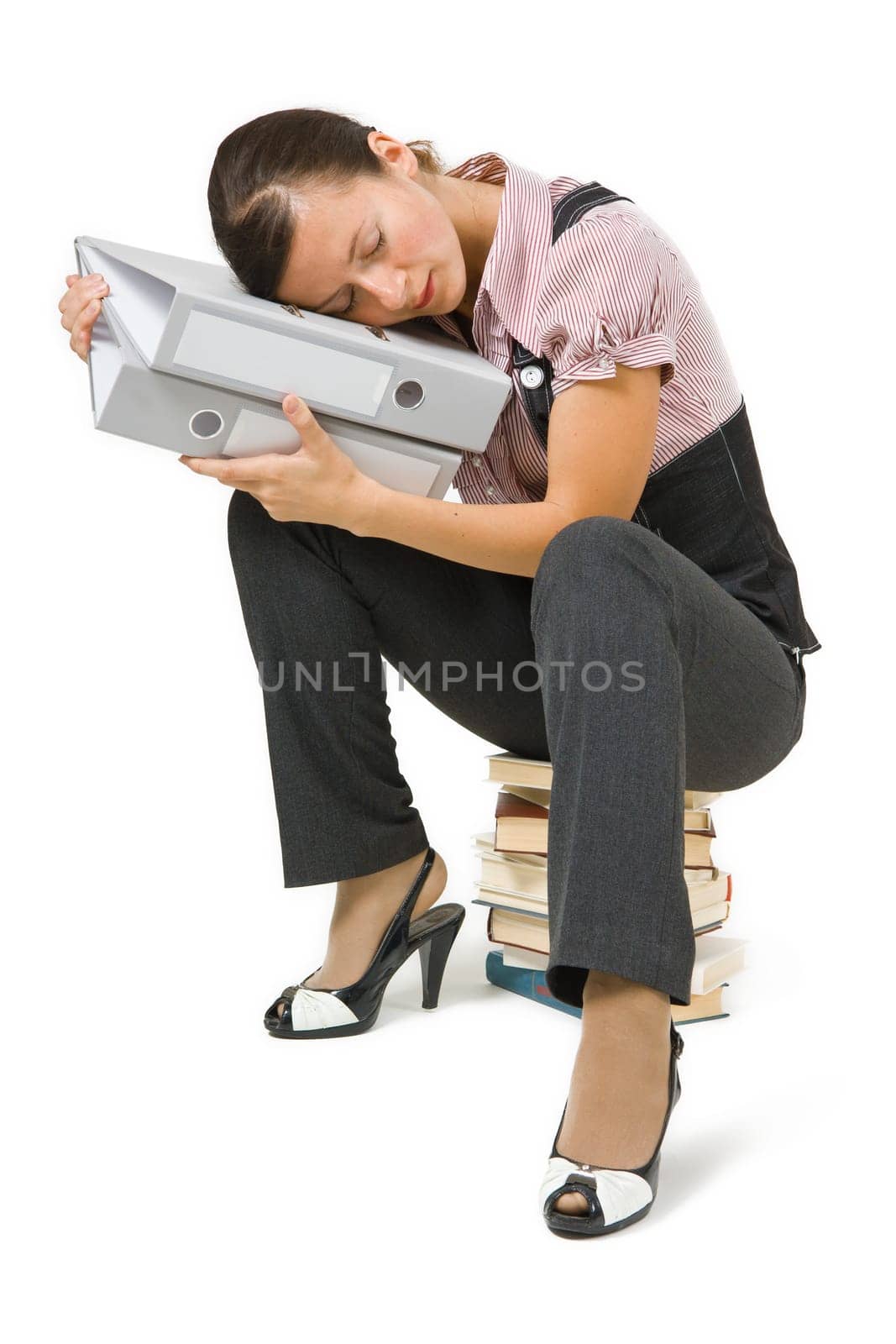 tired businesswoman sleeping on the books on a white background