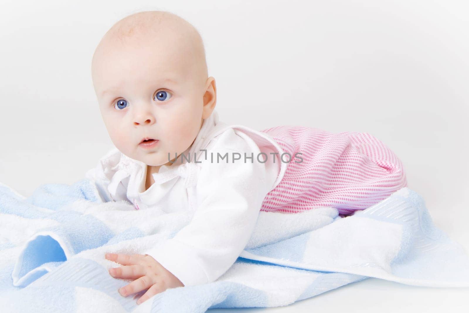 baby girl in the studio on the floor