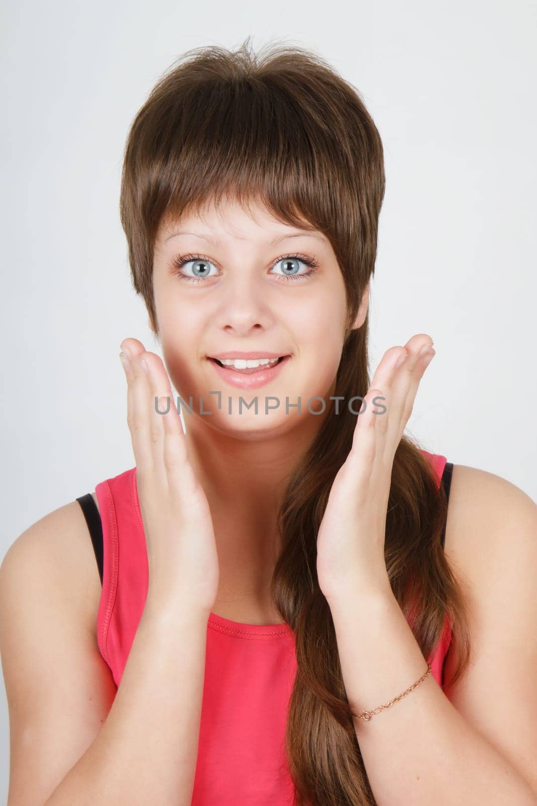 on a white background beautiful delighted happy girl with blue eyes