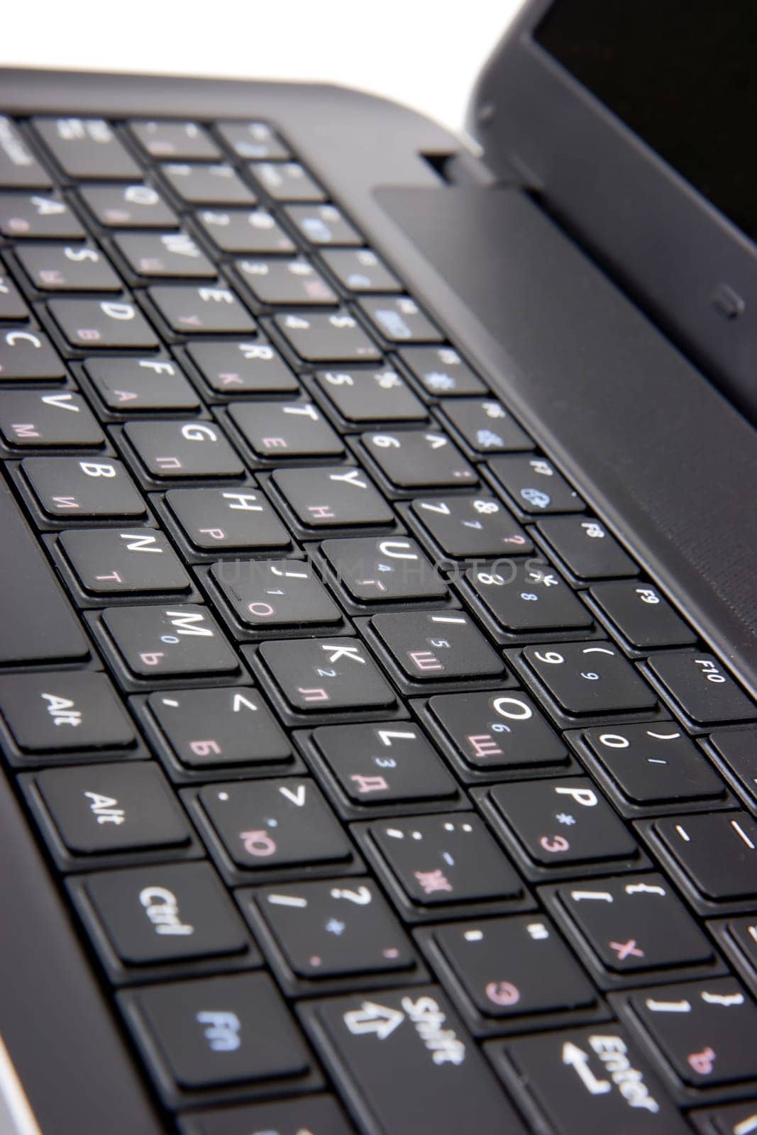 laptop keyboard closeup. Studio shot on white background