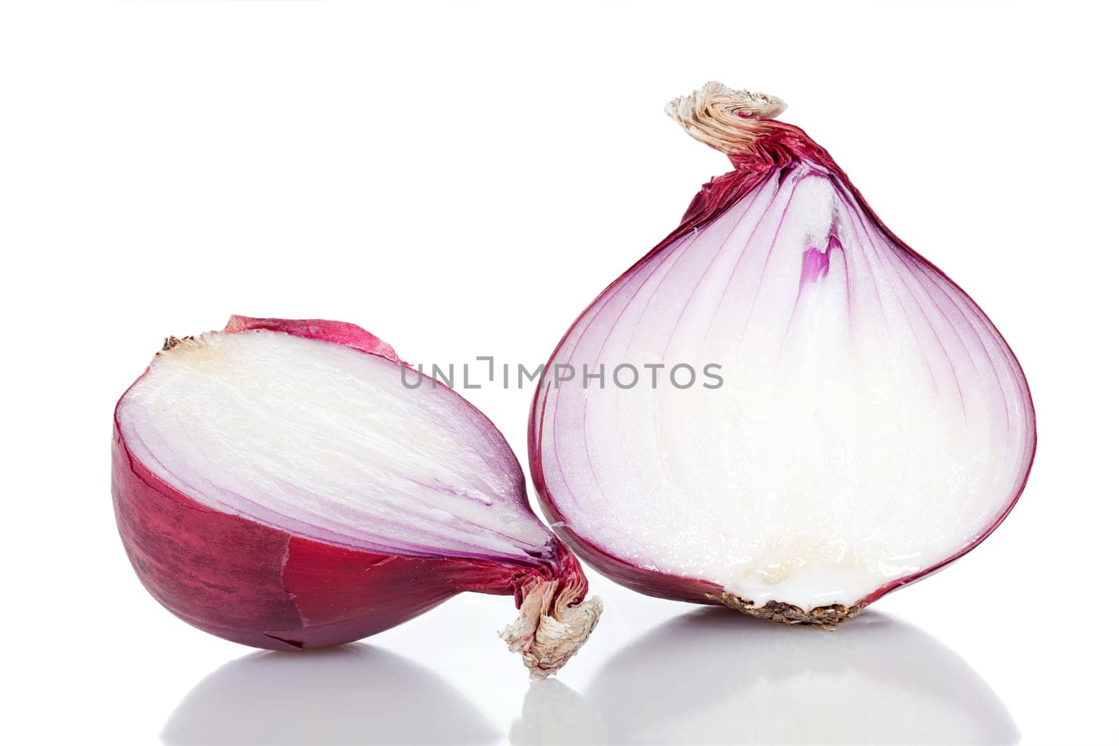 Two halves of a red onion insulated against a white background