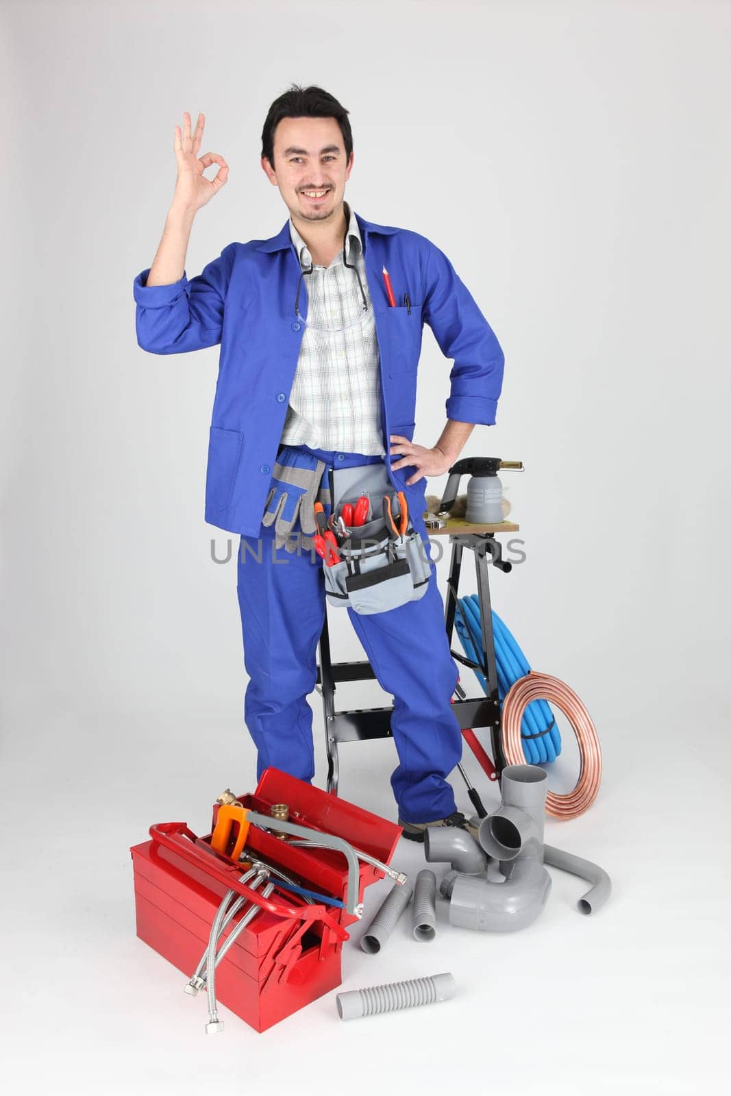 plumber doing OK sign