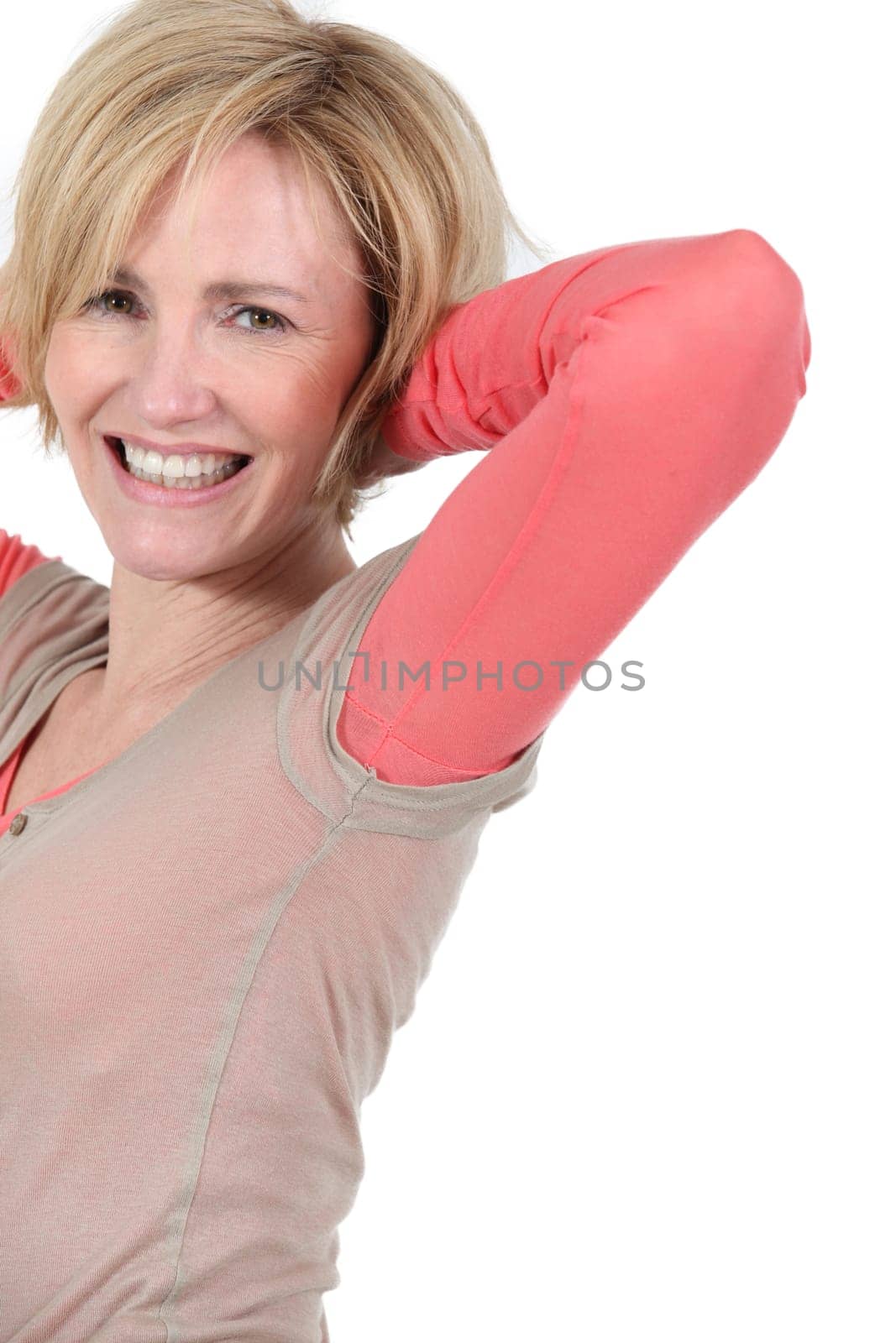 Woman with hands behind head