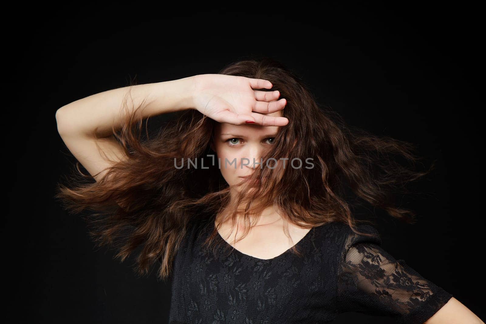 sexy girl with flowing long hair on a black background
