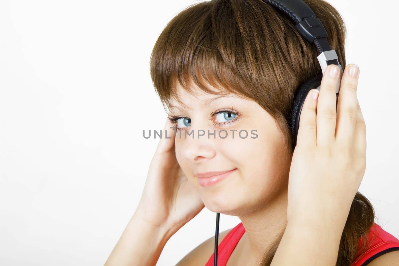 beautiful smiling girl teenager in the headphones