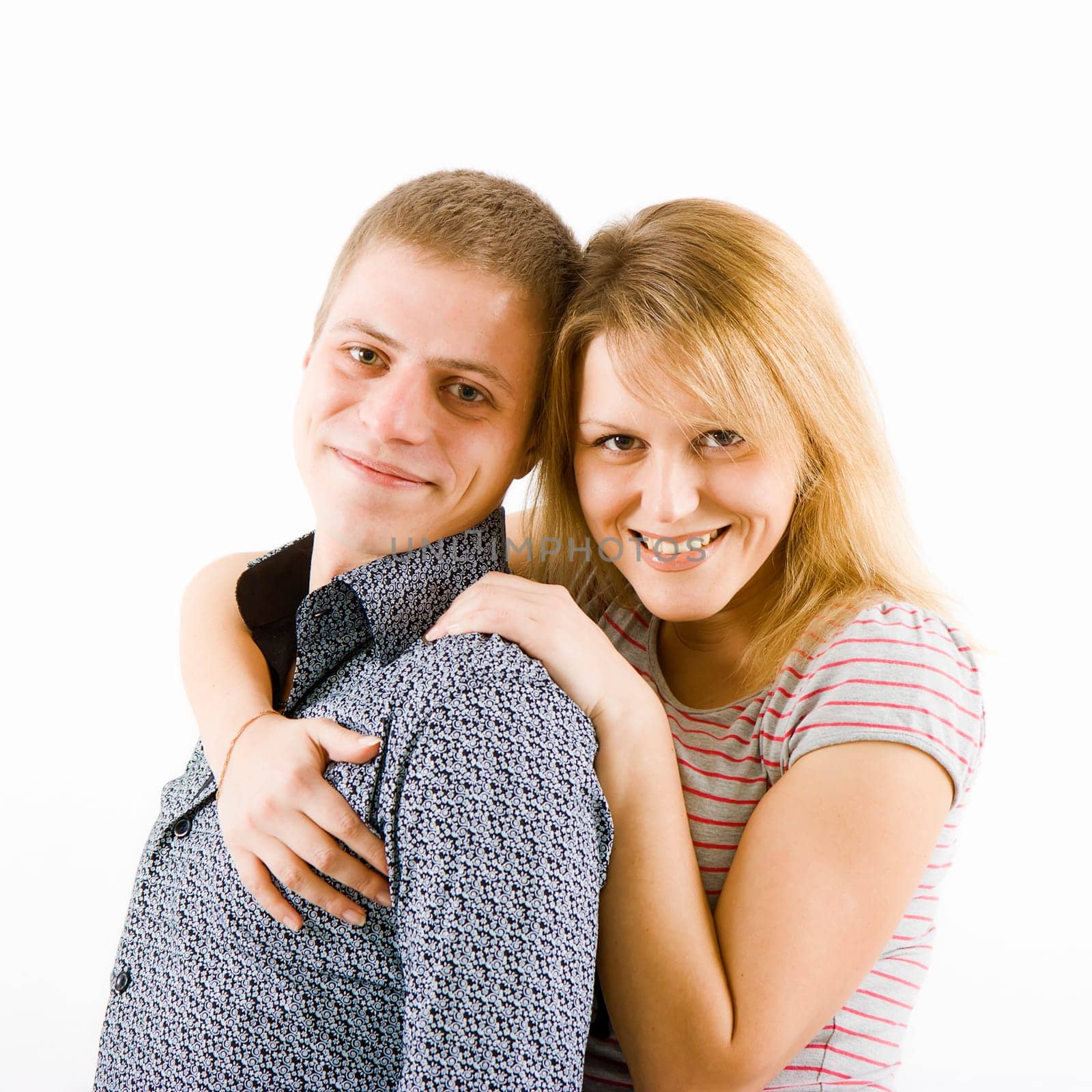 happy young couple. The girl hugs a guy. white background