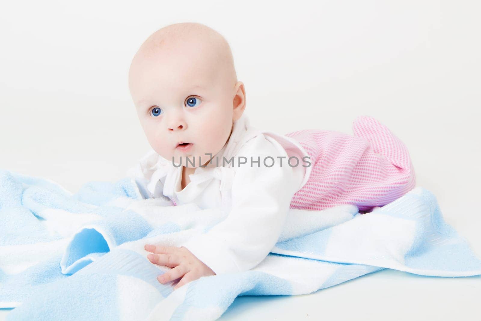 baby girl in the studio on the floor