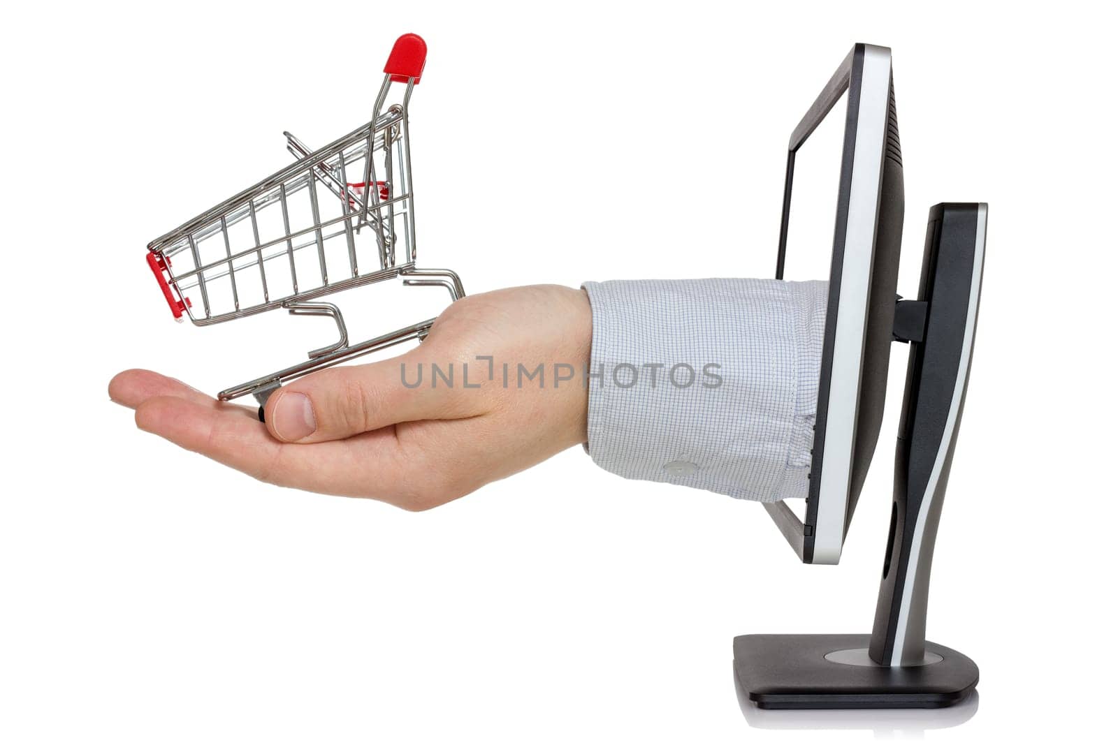 E-commerce conception. Computer monitor and hand with shopping cart
