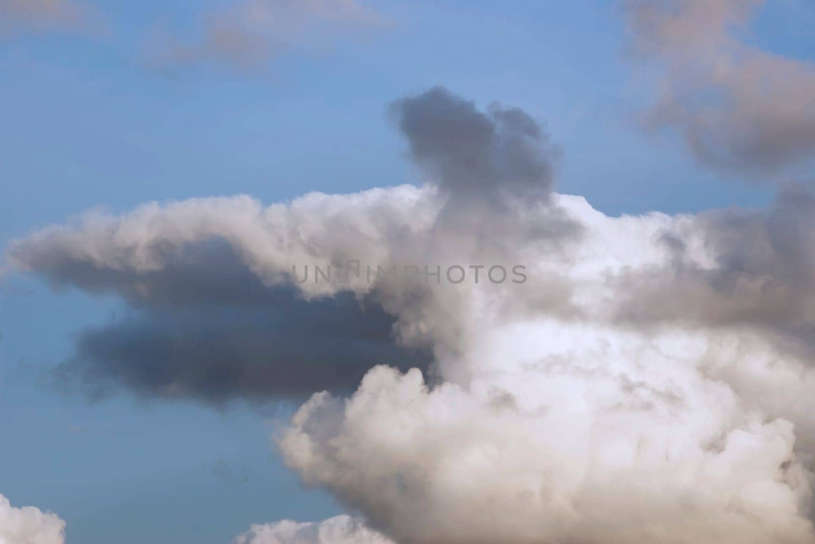 a natural storm shaped clouds in a beautiful blue sky