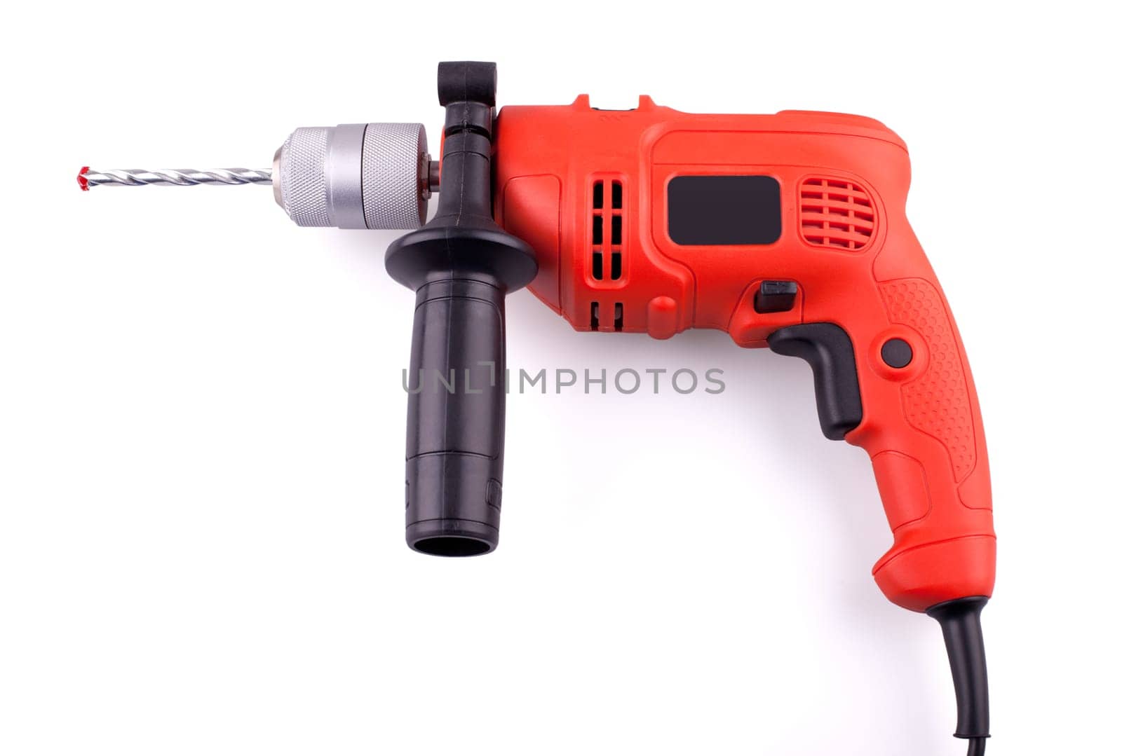 Orange electric drill with handle isolated on white background.