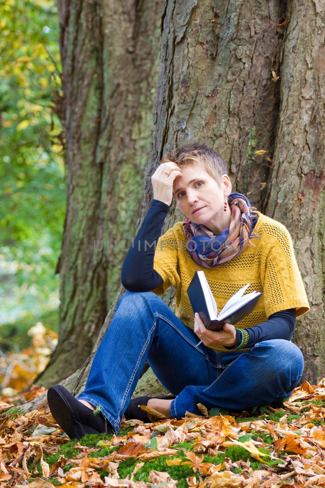 Woman reading book in the park
