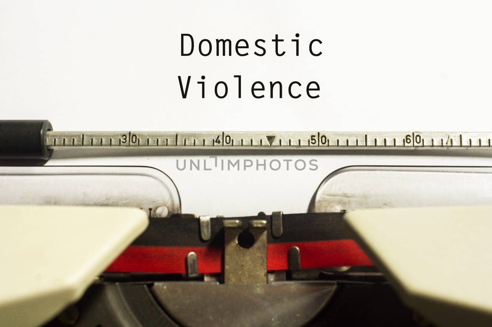 domestic violence concept, with message on typewriter paper.