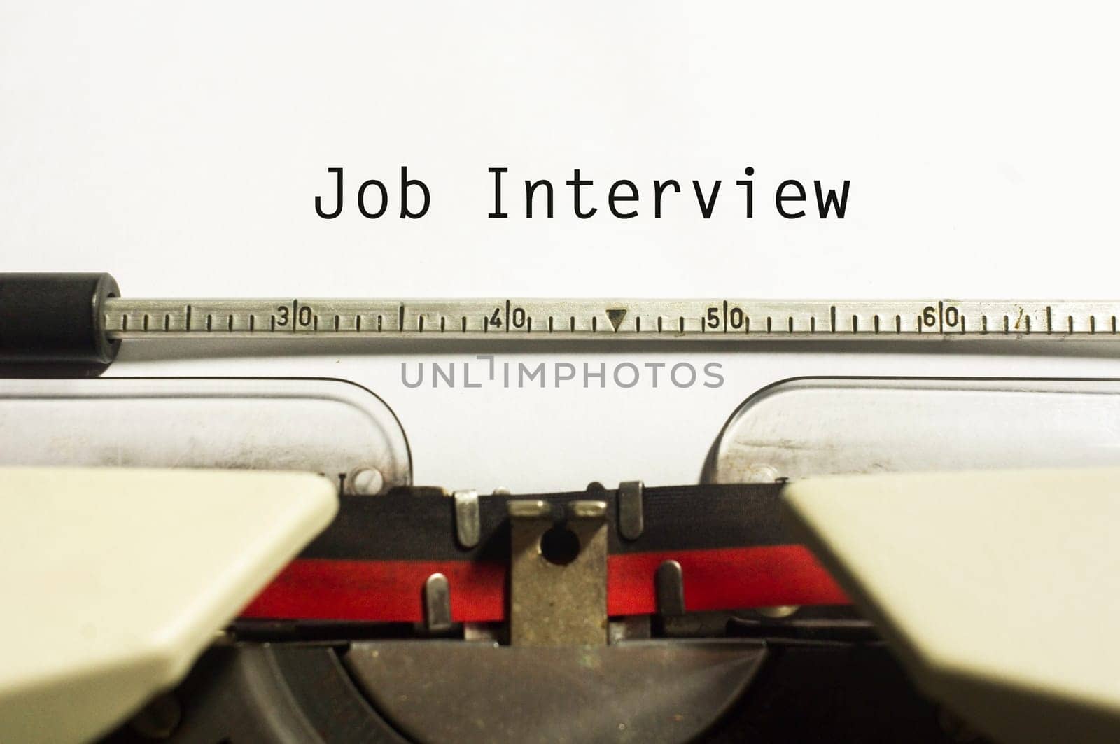 concept of job interview, with message on typewriter.