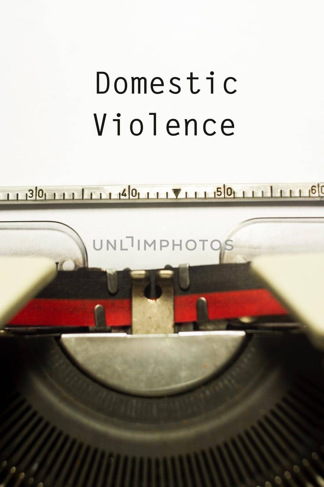 domestic violence concept, with message on typewriter paper.