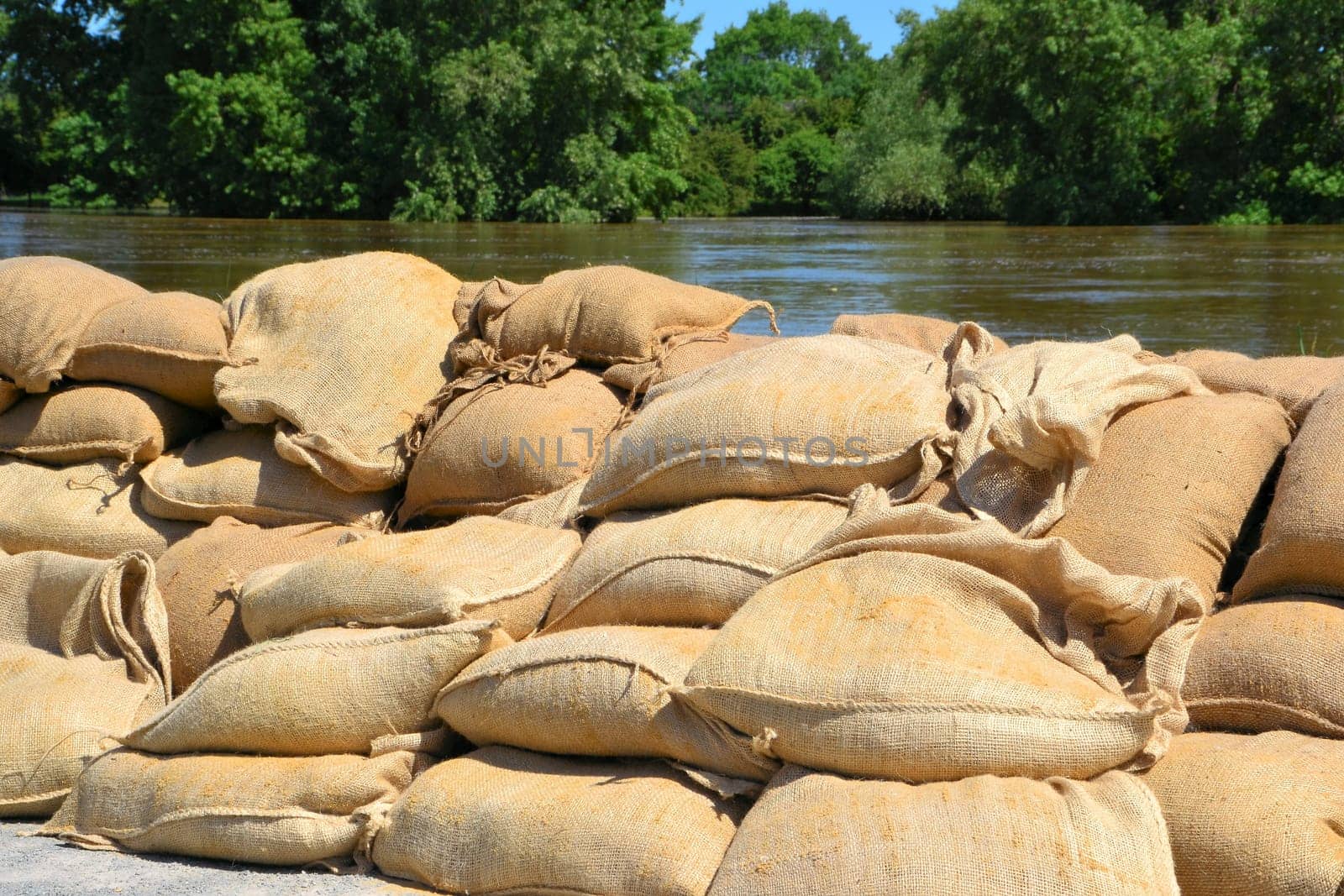 Sandbags as squatting water protection on the Elbe near Magdeburg