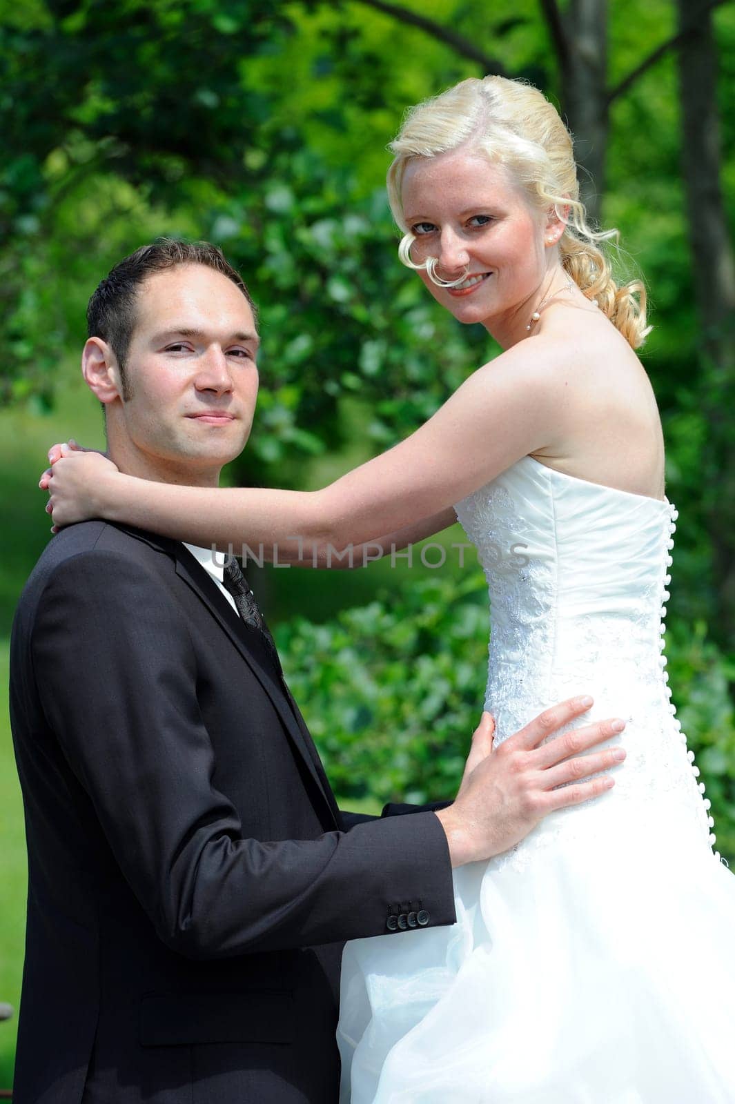 Bridal couple hugs each other