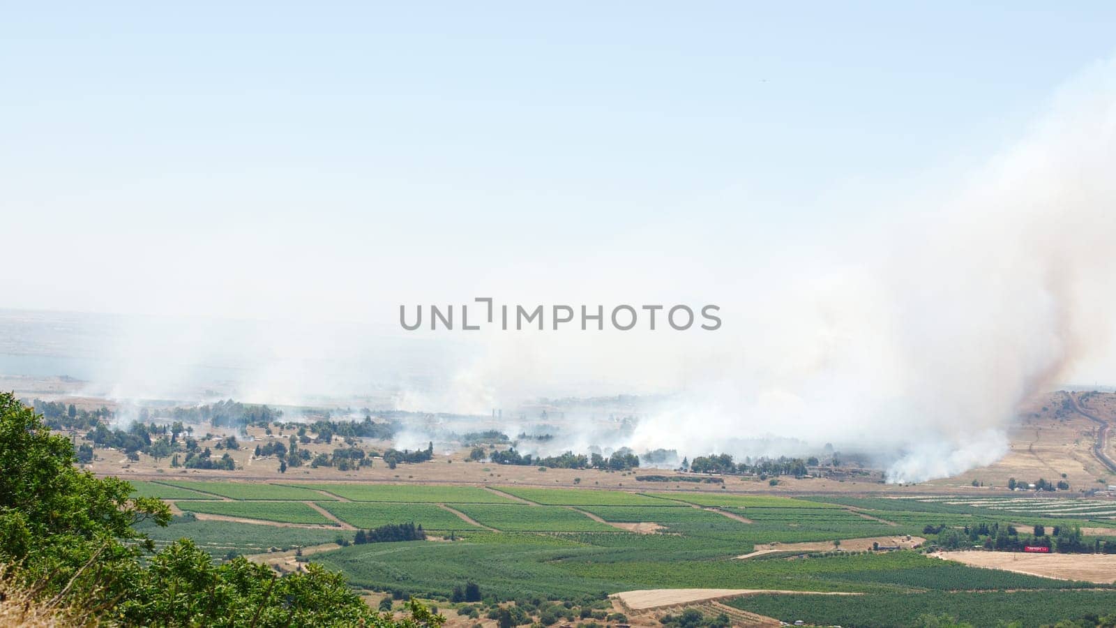 JUNE 06: Fire and smoke - war in Syria near Israeli border on June 06, 2013 in Qunaitira, Syria