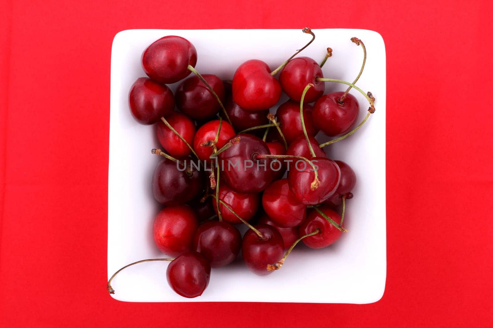 Lots of cherries in a bowl