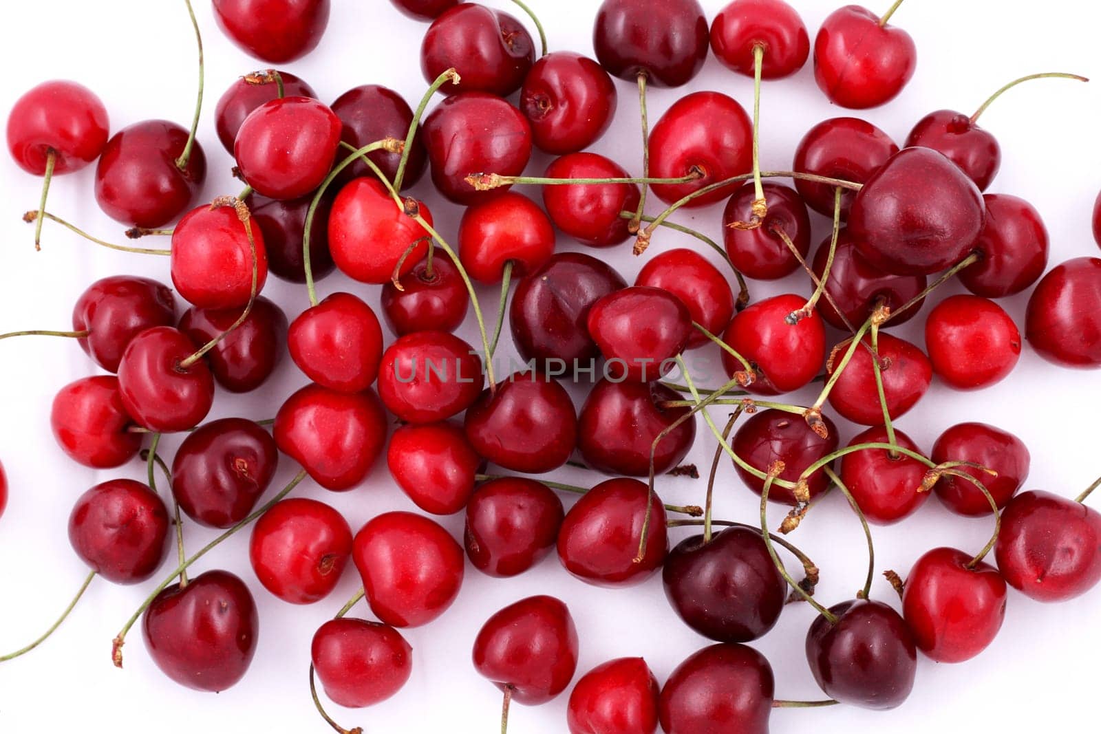Lots of cherries over white background