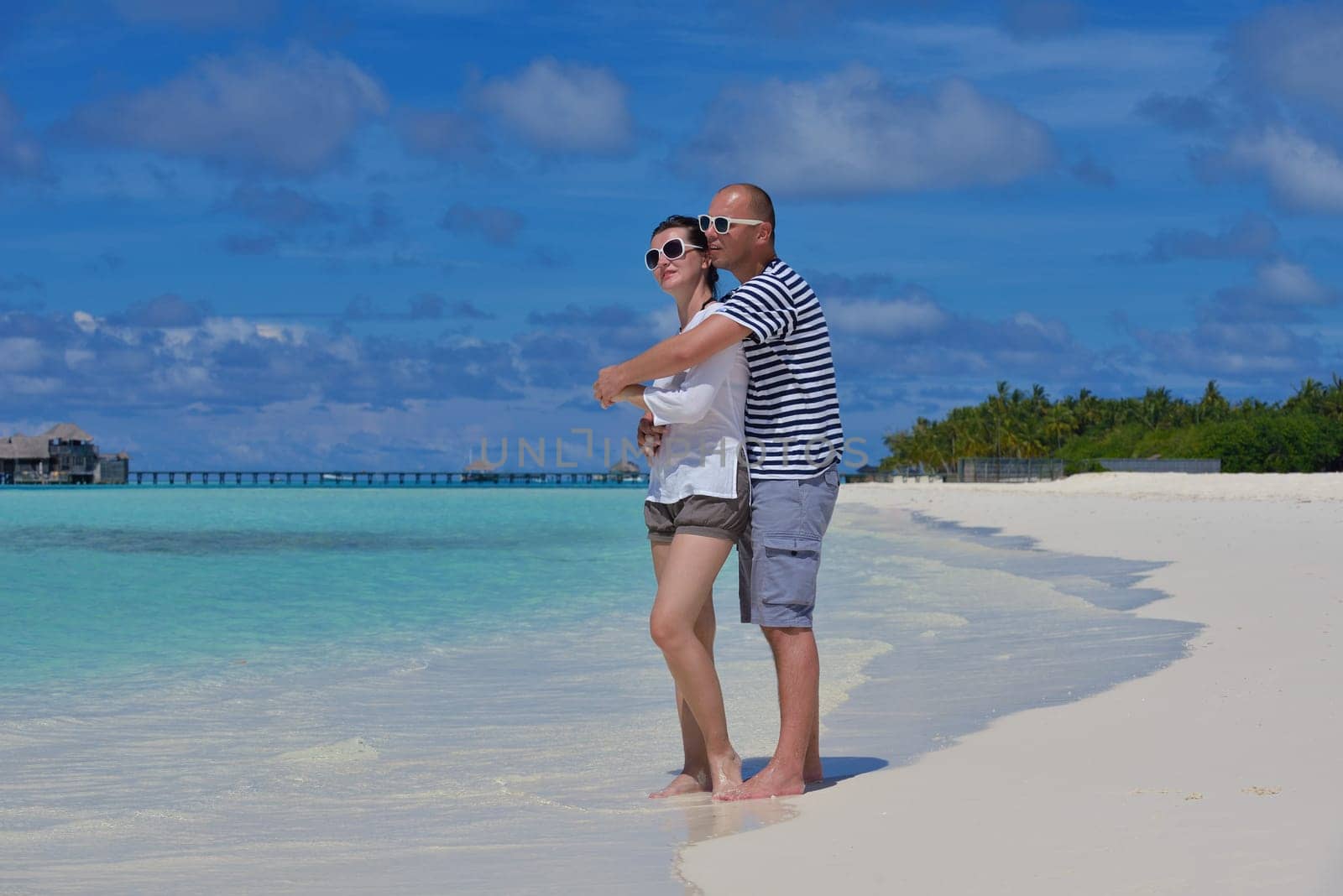 happy young couple relax and take fresh drink at summer vacation