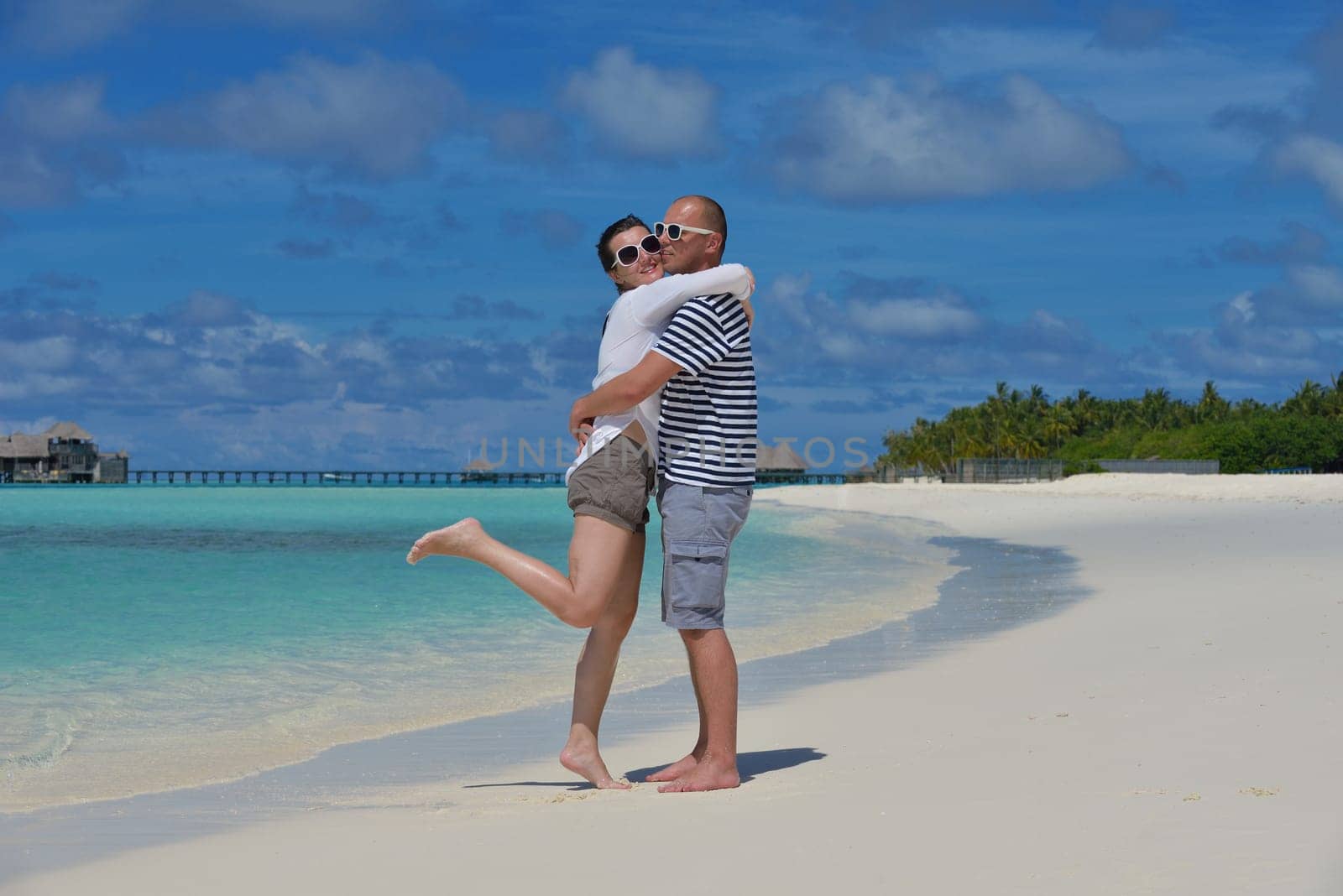happy young couple relax and take fresh drink at summer vacation