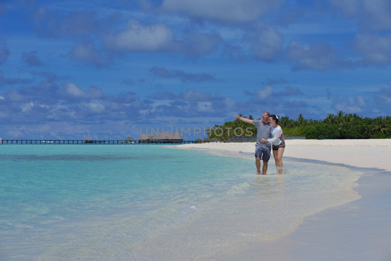 happy young couple relax and take fresh drink at summer vacation