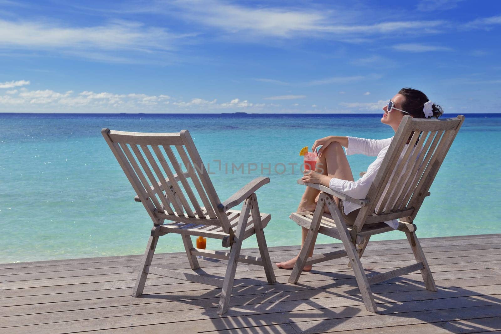happy young couple relax and take fresh drink at summer vacation