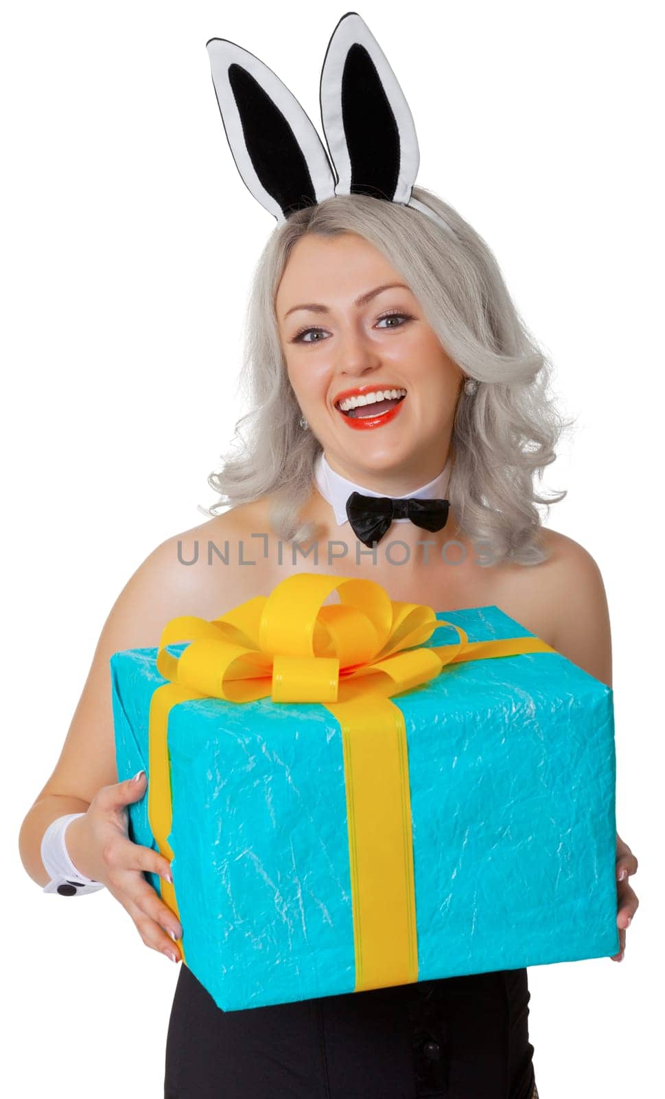 Laughing blonde woman with rabbit ears and a gift box isolated on white background
