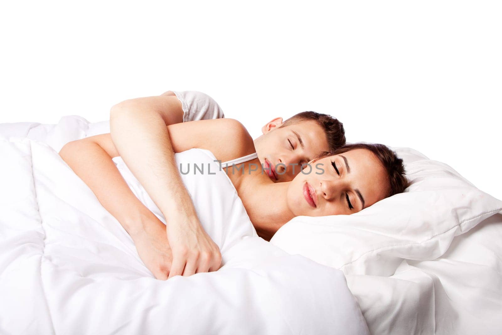 Young couple happily sleeping in white bed, isolated.