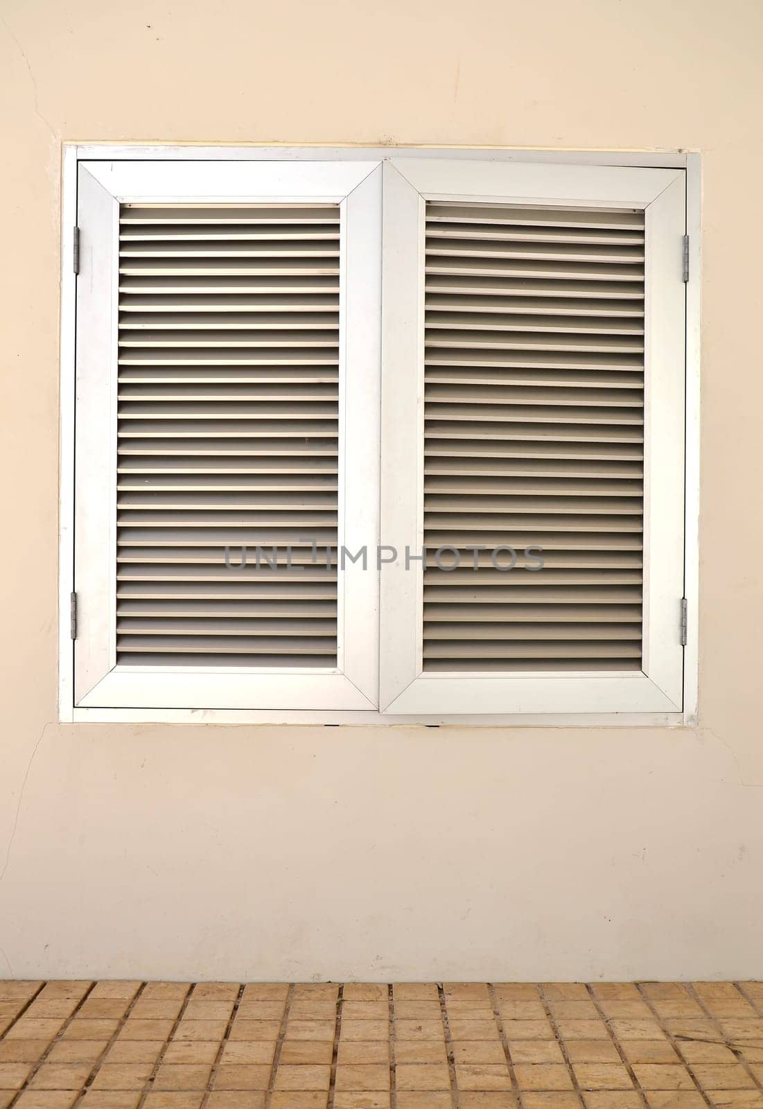 An industrial ventilation fan attached to a building